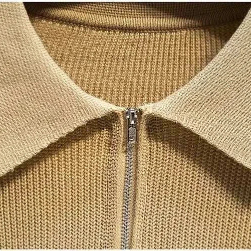 Close-up of beige half zipper sweater with collar from Antonio's collection.