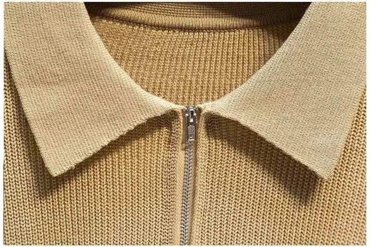 Close-up of beige half zipper sweater with collar from Antonio's collection.