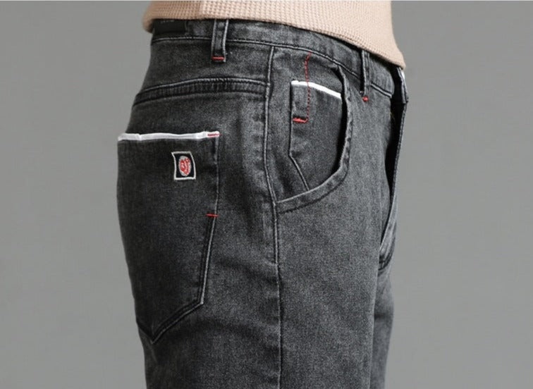 Vinny Vintage Jeans in dark denim fabric, side view showing fit and pocket detail.