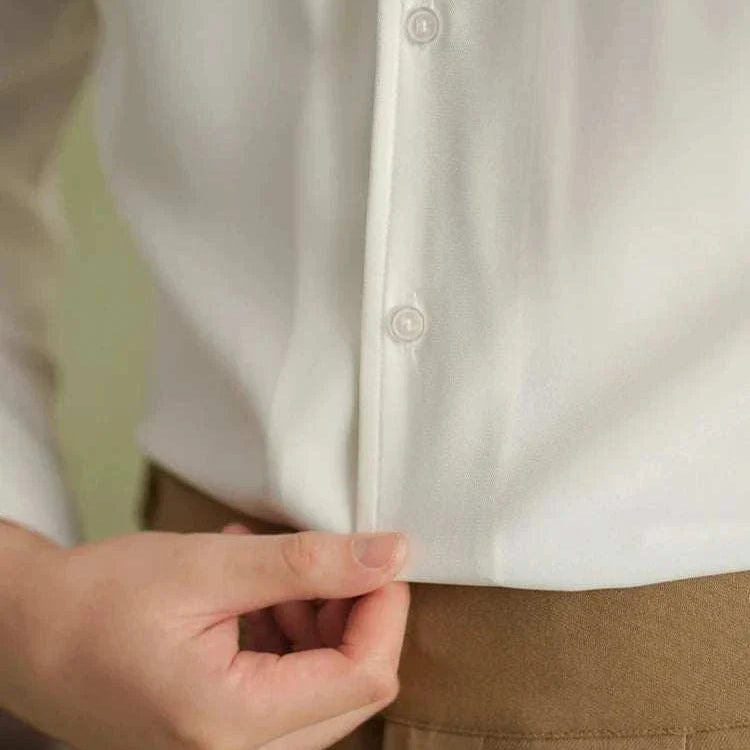 Spring pointer collar long sleeve shirt in white polyester fabric, button detail.