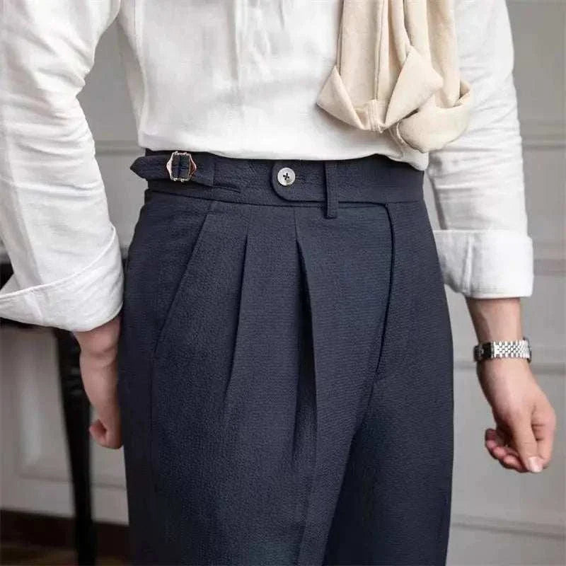 High-waist belt design trousers made of 100% viscose, offering a comfortable and flattering fit.
