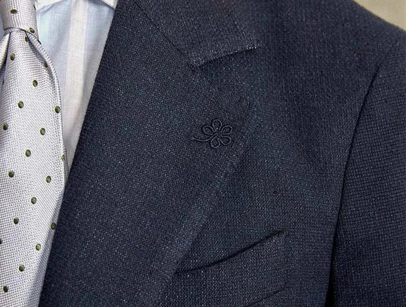 Slim fit cotton-linen blend jacket with elegant design and high-quality material.