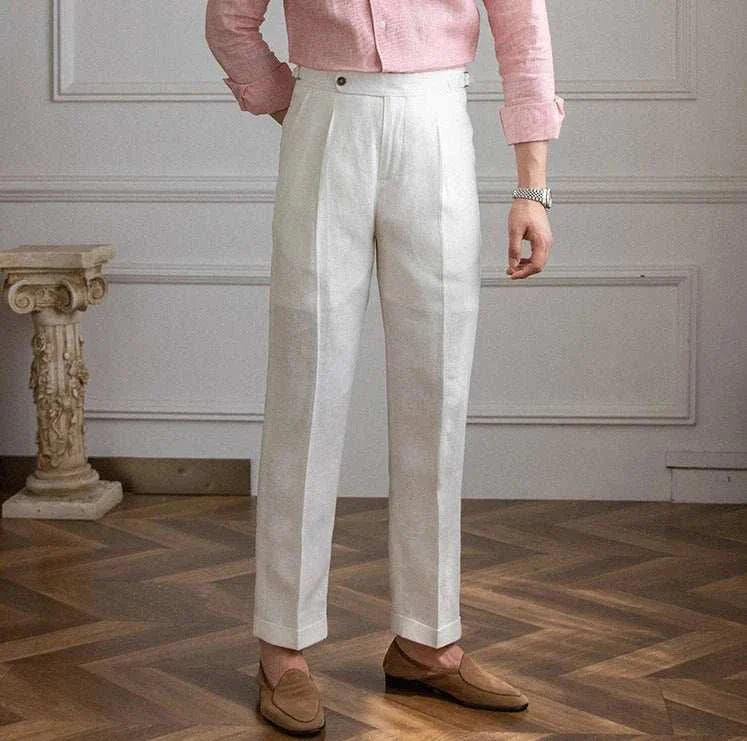 Lightweight Italian high-waist trousers in white linen, styled for casual elegance.