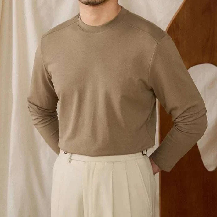 Slim fit smart casual premium sweater in brown, long sleeves, paired with beige pants.