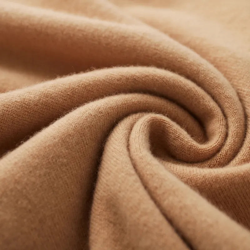 Soft wool texture of Antonios Pure Wool Sweater in caramel shade.