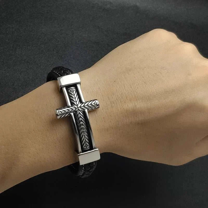 Cross stainless steel leather bracelet with sleek cross design worn on wrist.
