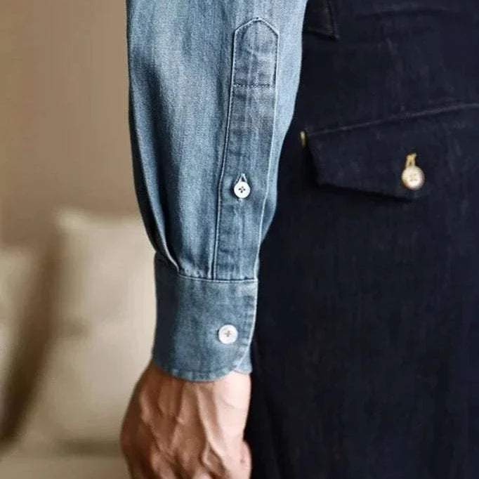 Close-up of the Office premium denim shirt showcasing sleeve detail and button.