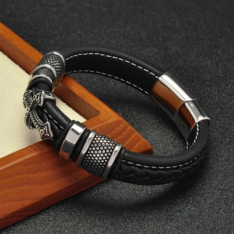 Cross punk leather bracelet with stainless steel and PU design.