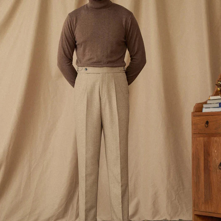 Wool winter Italian trousers on mannequin against beige background.