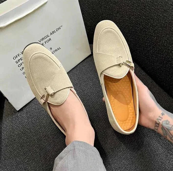 Elegant suede leather loafers for men in beige, featuring intricate perforations and cushioned insole.