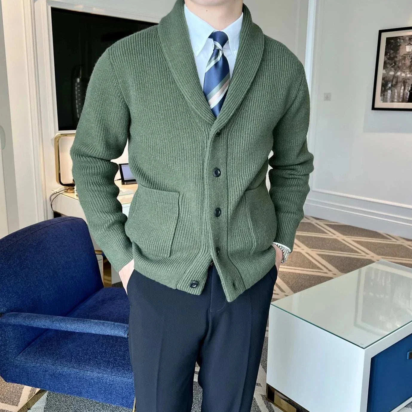 Men's fall season casual cardigan in green with shawl collar and button closure.