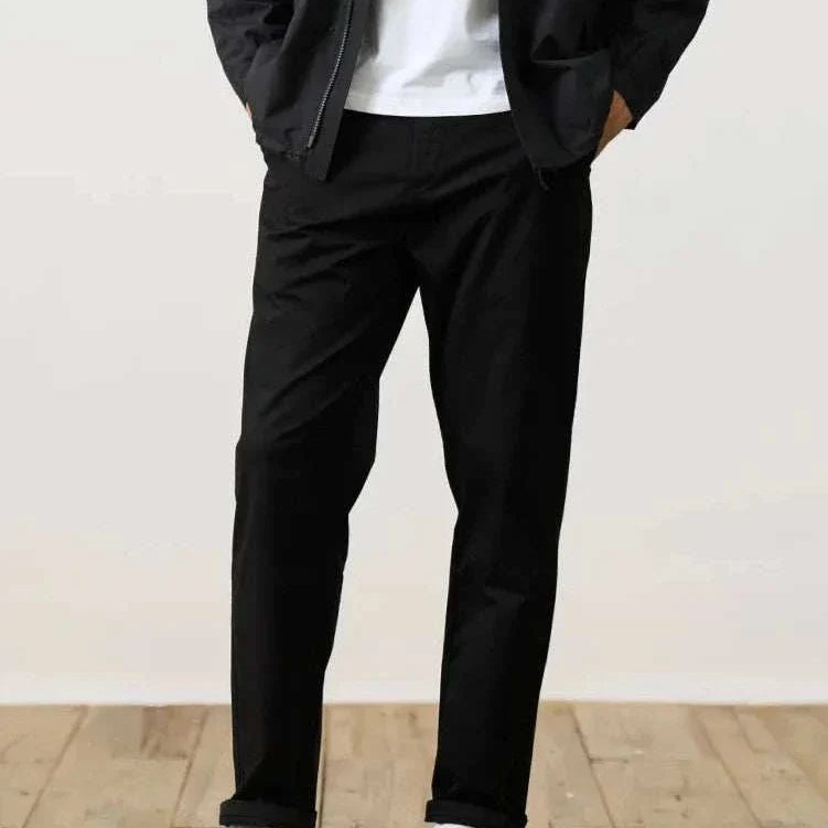 Classic chino pants in black, offering comfort with a cotton and spandex blend for smart and casual style.