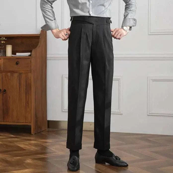 Male model wearing black autumn Italian high-waist trousers in a smart casual style.