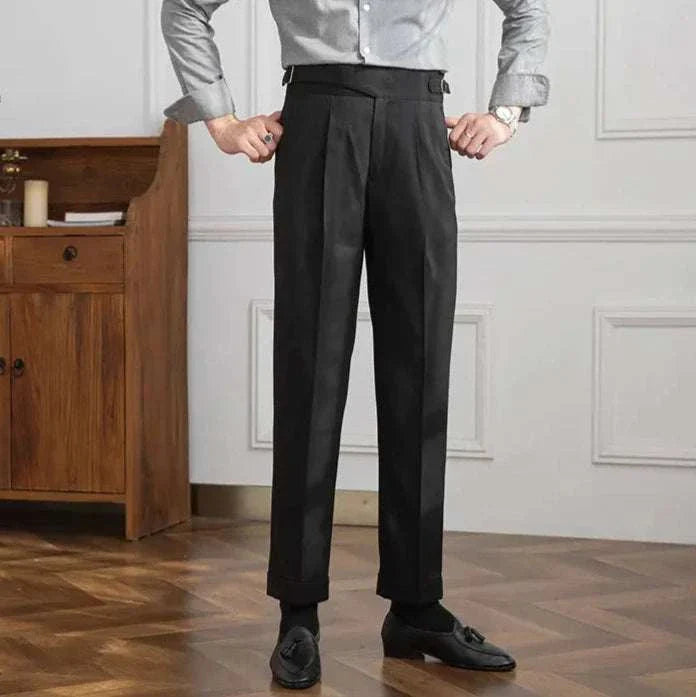Male model wearing black autumn Italian high-waist trousers in a smart casual style.