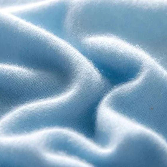 Pure wool and cashmere sweater fabric in light blue, perfect for cold seasons.