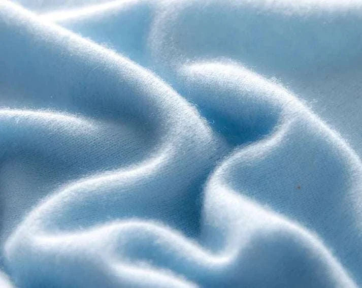 Pure wool and cashmere sweater fabric in light blue, perfect for cold seasons.