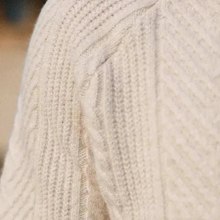 Close-up of an autumn lapel regular fit sweater with a textured knit pattern.