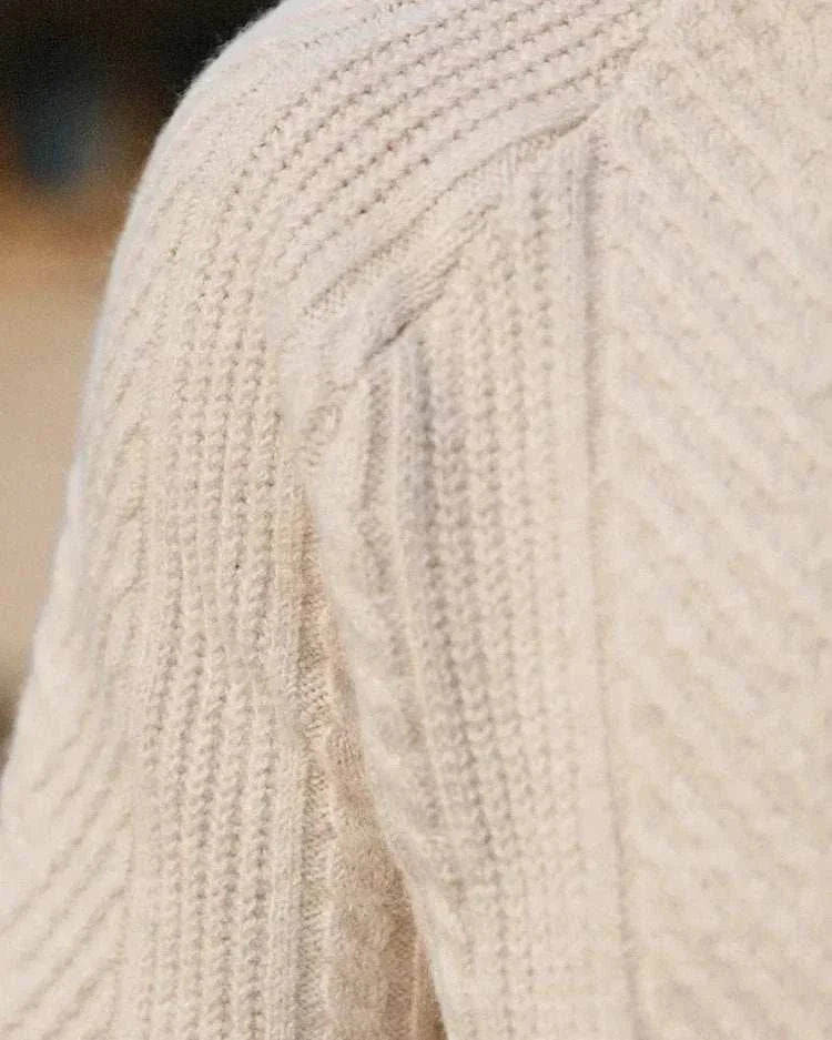 Close-up of an autumn lapel regular fit sweater with a textured knit pattern.