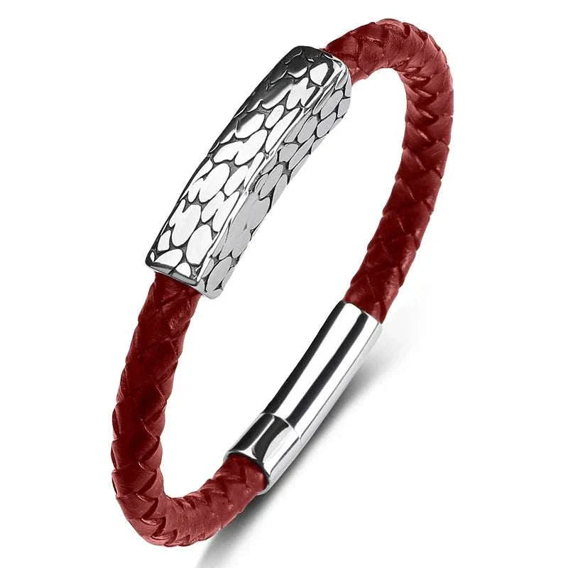 Genuine leather braided bracelet with stainless steel accents for rugged elegance.