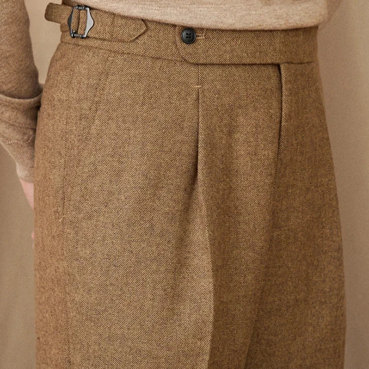 Wool winter Italian trousers in brown fabric close-up.