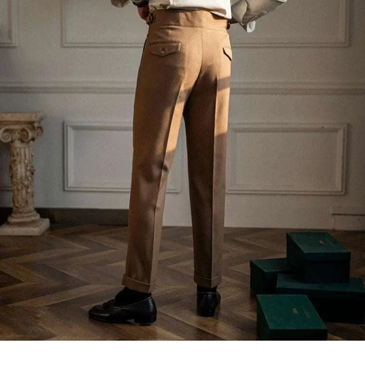 Male wearing cold season straight trousers in a stylish interior setting.