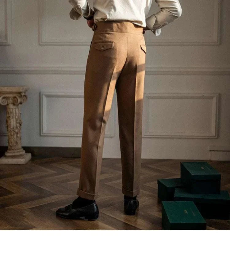 Male wearing cold season straight trousers in a stylish interior setting.