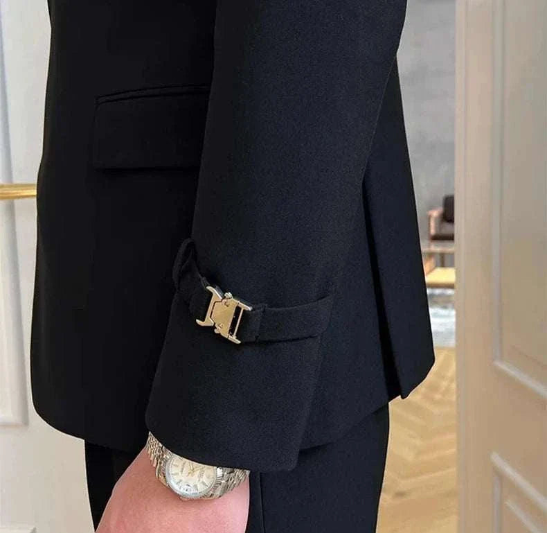 Elegant slim fit suit jacket with stylish buckle detail on sleeve.