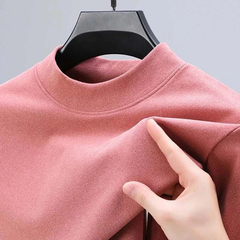 Soft pink classic turtleneck sweater made of premium cotton material.