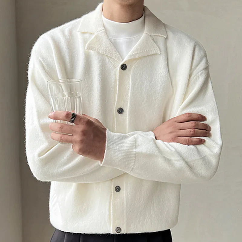Oxford fall cardigan in white worn by a man for stylish autumn look.