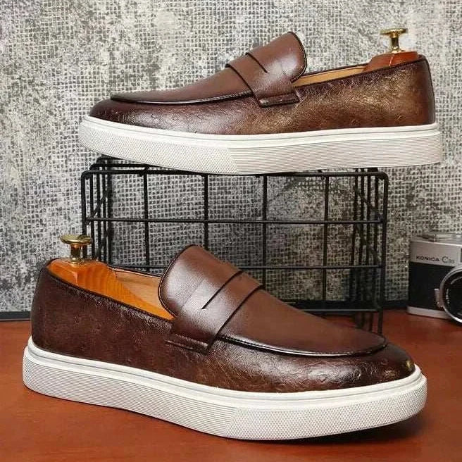British style casual loafers with brown leather finish and white sole.