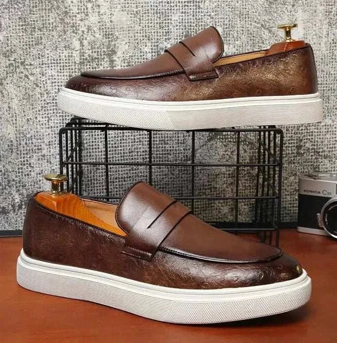 British style casual loafers with brown leather finish and white sole.