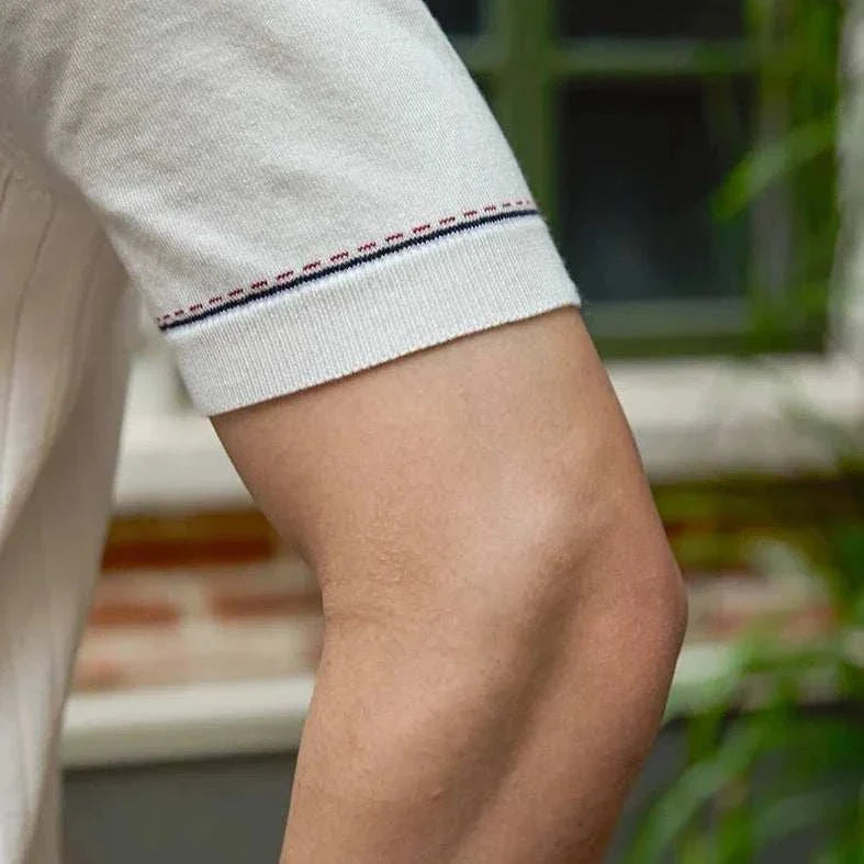 Close-up of a stylish and breathable Old Money polo English t-shirt sleeve.