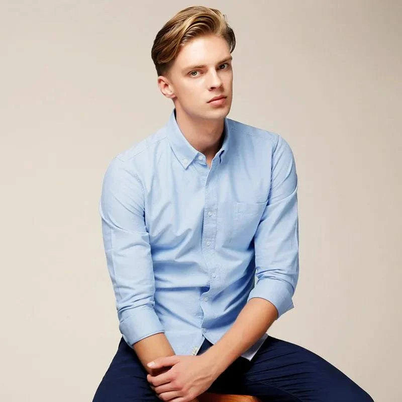 Business casual slim fit shirt in light blue for men, ideal for office wear.