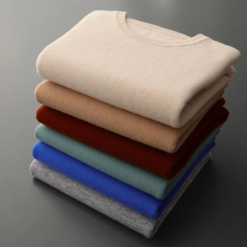 Stack of Antonios Pure Wool Sweaters in various colors including beige, brown, blue, and grey.
