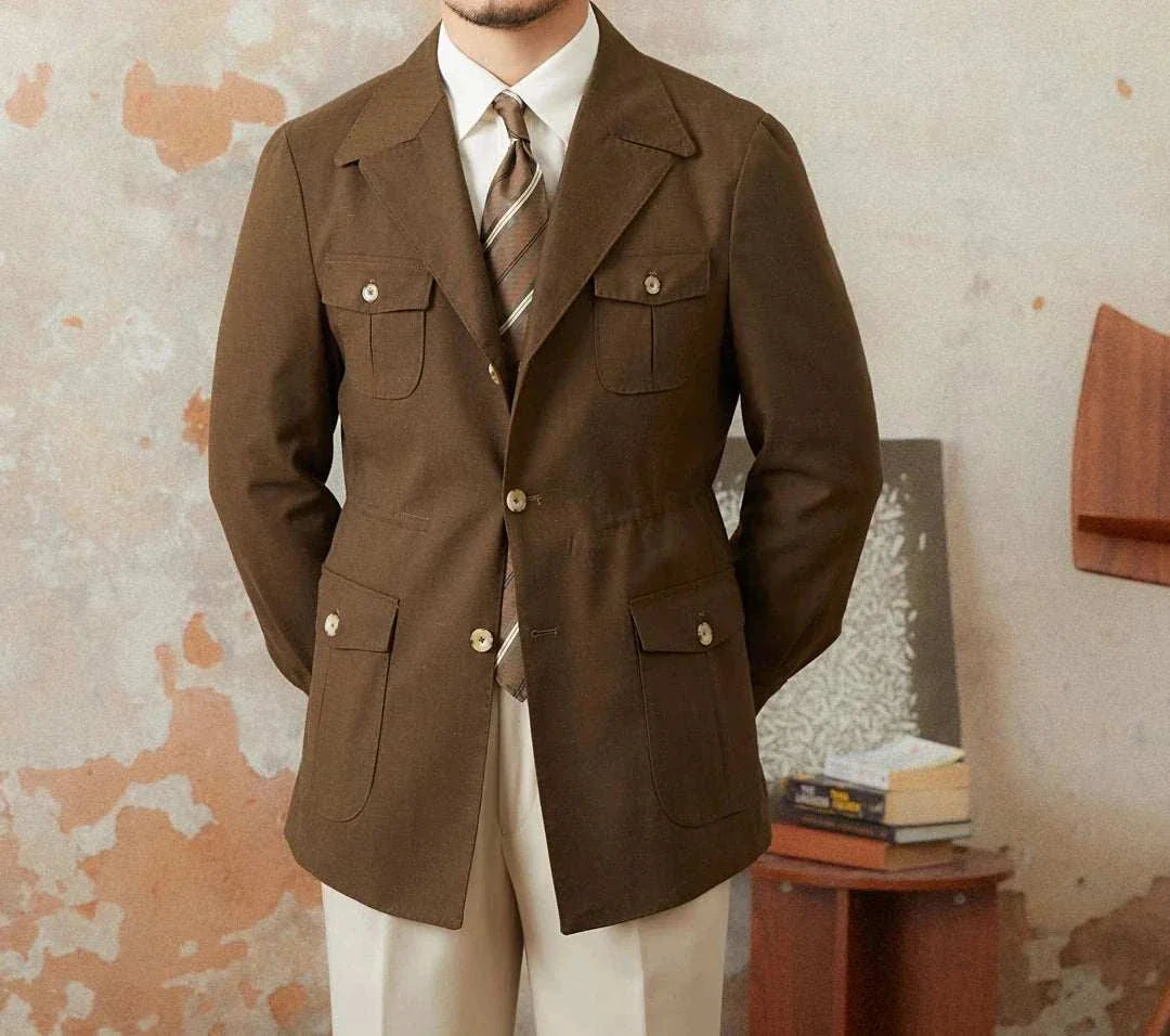 Man wearing an Autumn vintage old money coat, brown with a classic design, paired with a tie and white pants.