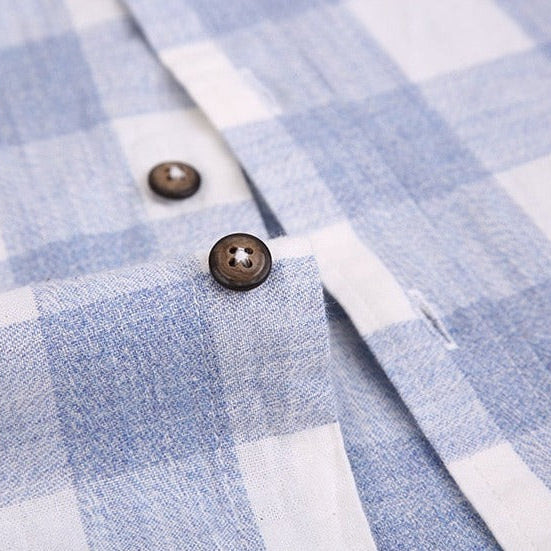 Close-up of Maurice Plaid Shirt in blue and white cotton-linen blend with buttons.