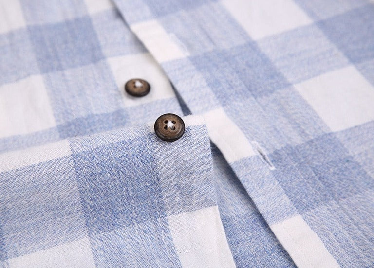 Close-up of Maurice Plaid Shirt in blue and white cotton-linen blend with buttons.