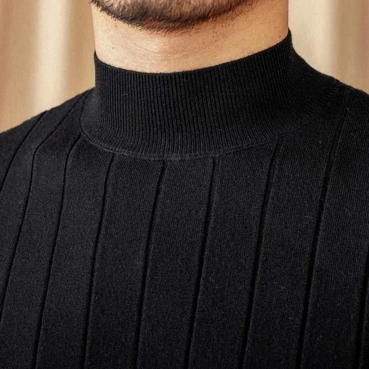 Autumn turtleneck premium sweater in black wool and acrylic blend for men, close-up view.