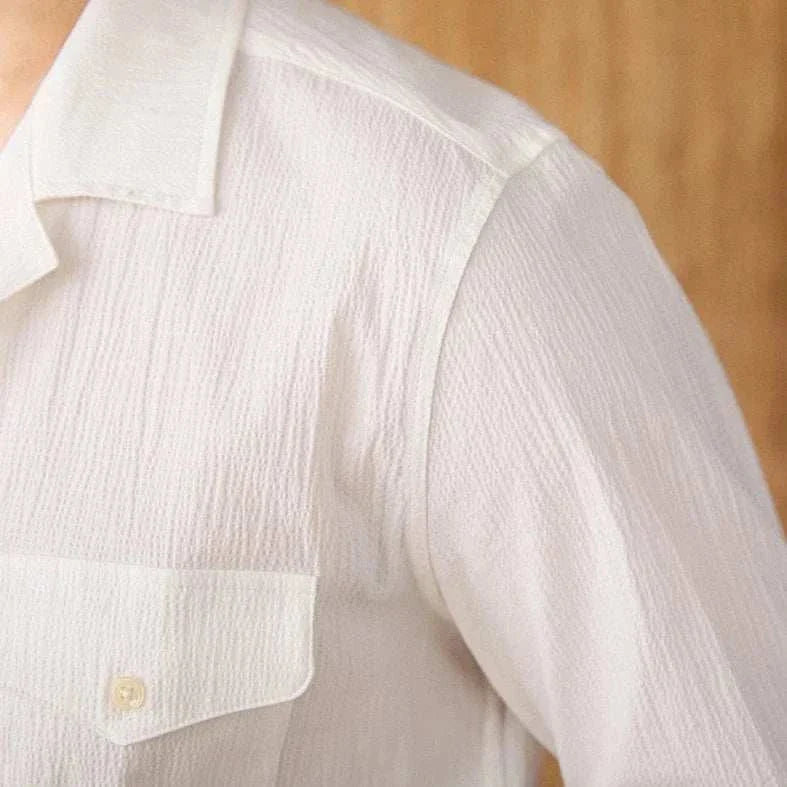 Cuban collar relaxed fit elegant shirt in solid white, lightweight cotton fabric.