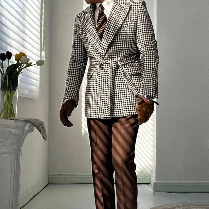 Man wearing a houndstooth woolen retro suit blazer in a bright room.