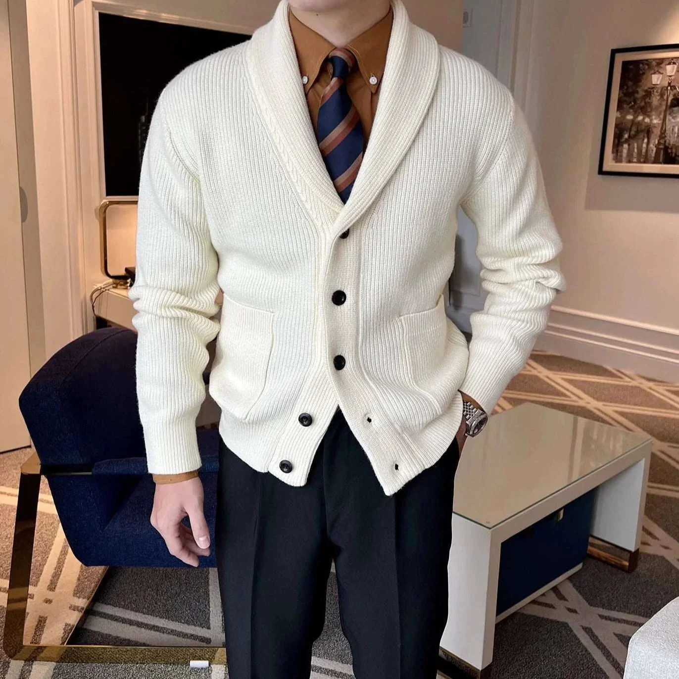Men's fall season casual cardigan in white with shawl collar, buttons, and pockets.