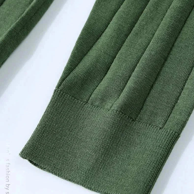 Casual wool autumn sweater sleeve detail showing fine ribbed texture.