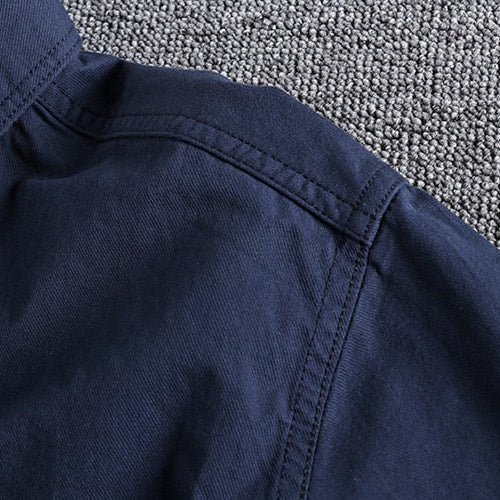 Navy blue Vintage-Retro Cotton Shirt with detailed stitching on carpet background.