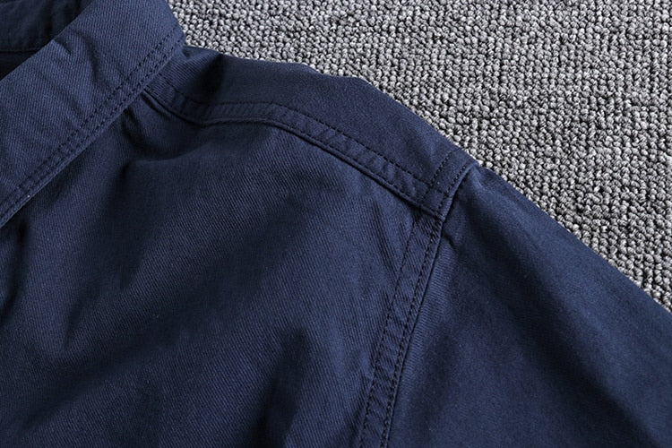 Navy blue Vintage-Retro Cotton Shirt with detailed stitching on carpet background.