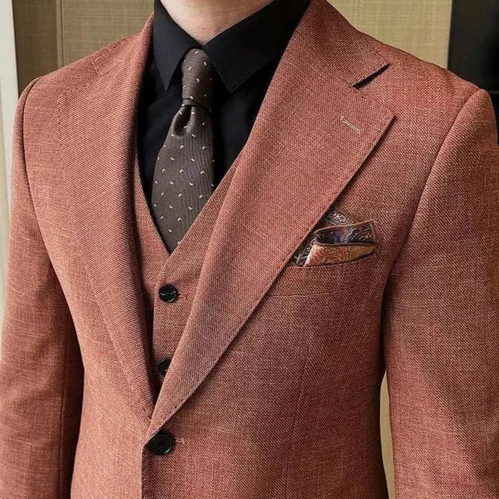 Groom wedding 3 piece suit in elegant brown with matching tie and pocket square.