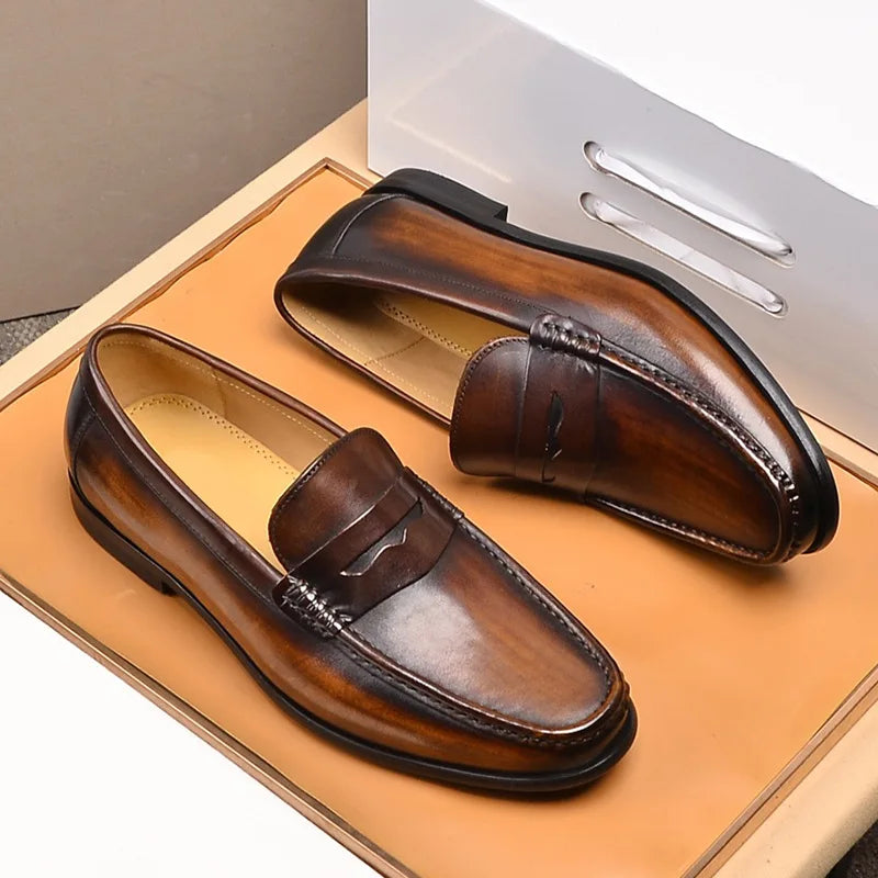 Luxury penny slip on genuine leather loafers for men in brown, showcasing Italian craftsmanship and elegance.
