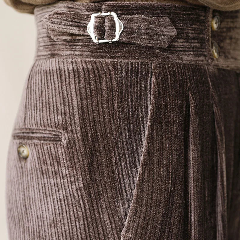 Italian business corduroy trousers close-up detail showing fabric texture and buckle.