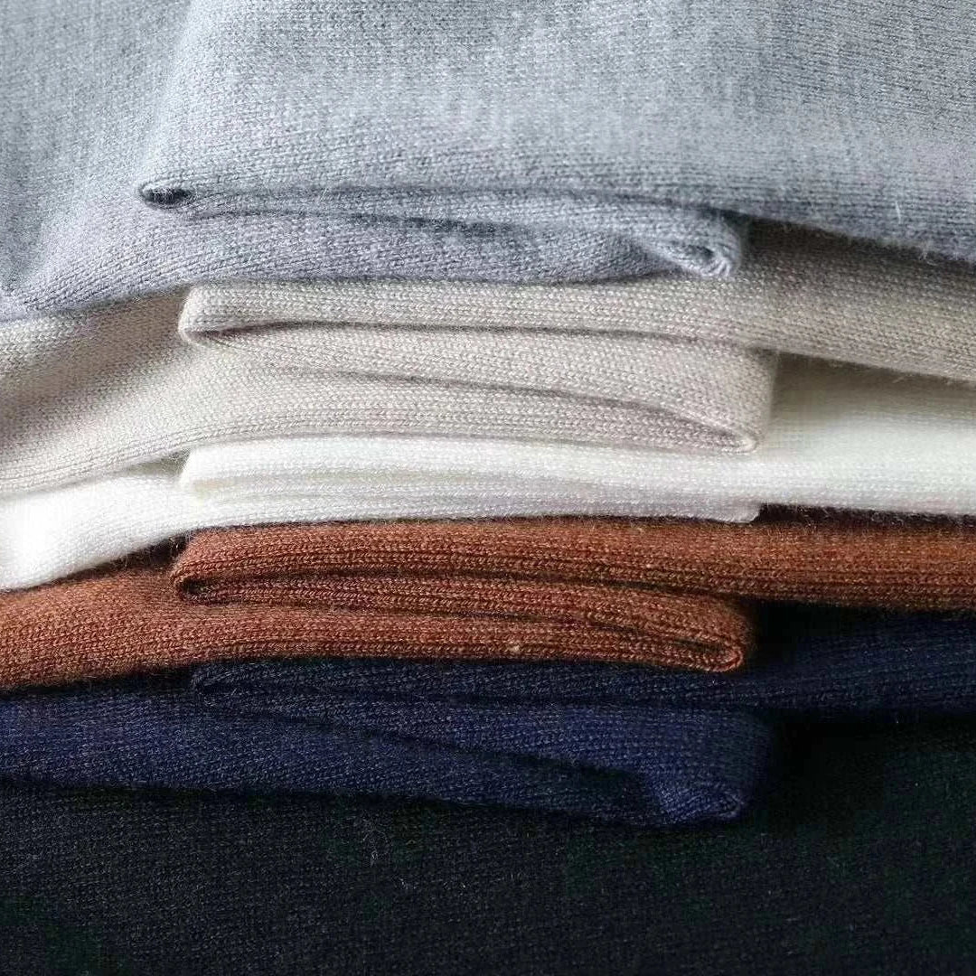 Folded autumn Korean premium sweaters with buttons in assorted colors.