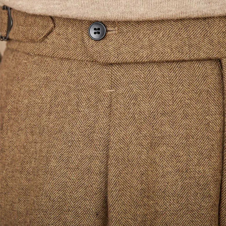 Close-up of wool winter Italian trousers in brown herringbone fabric.