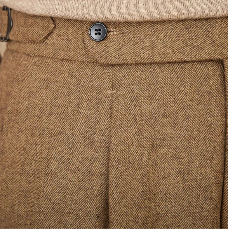 Close-up of wool winter Italian trousers in brown herringbone fabric.